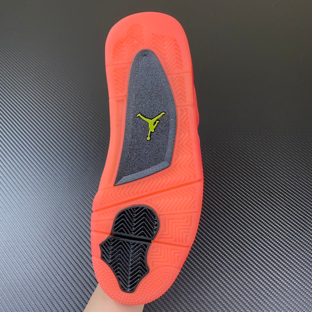Pink Air Jordan 4 sneaker outsole with Jumpman logo and tread