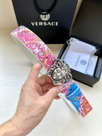 Embellished Versace belt with pink and blue baroque print and silver lion-head buckle