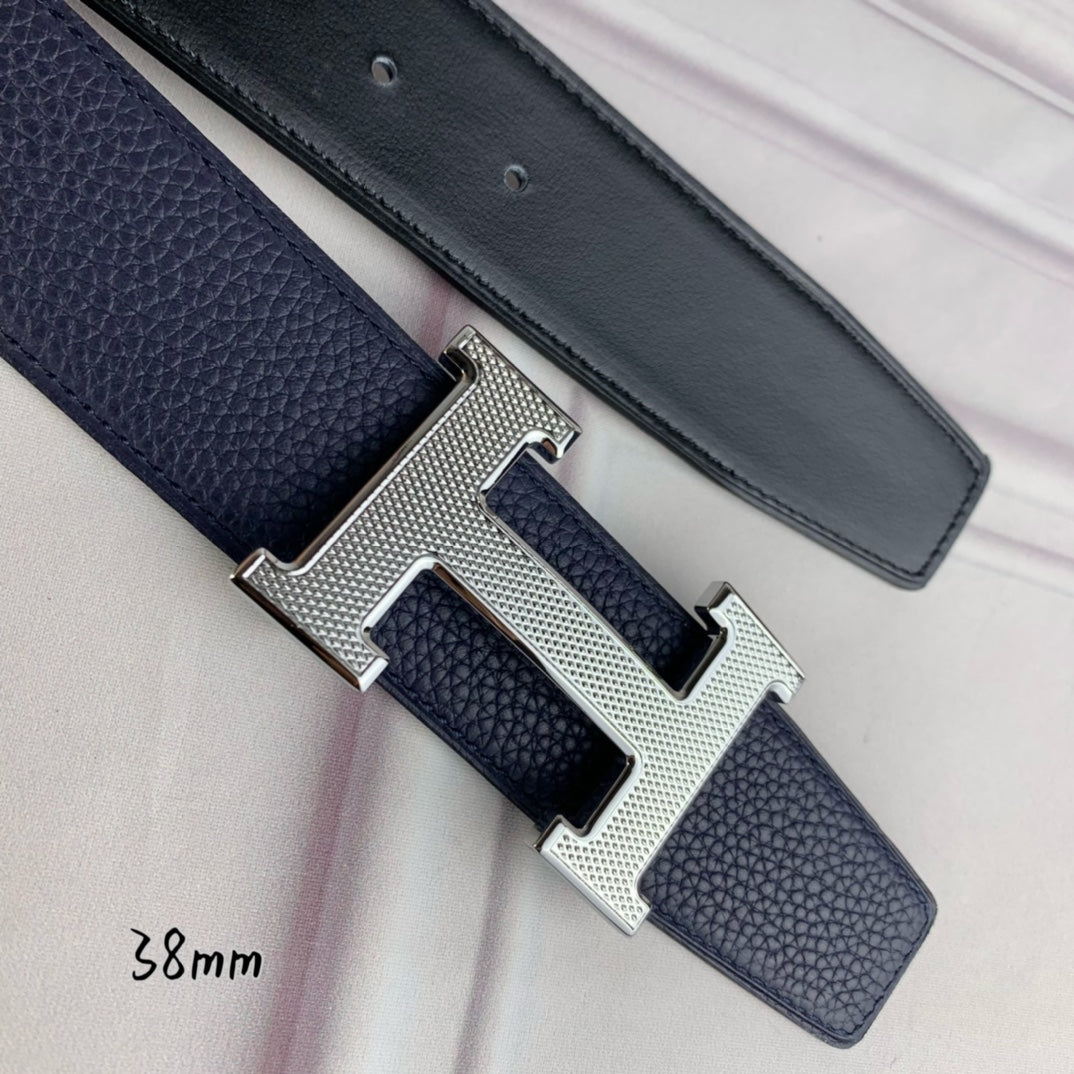 Hermes belt in dark blue leather with silver-tone H buckle close-up, 38mm
