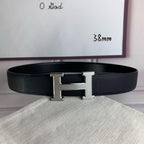 Black pebbled leather belt with silver H-style buckle centered