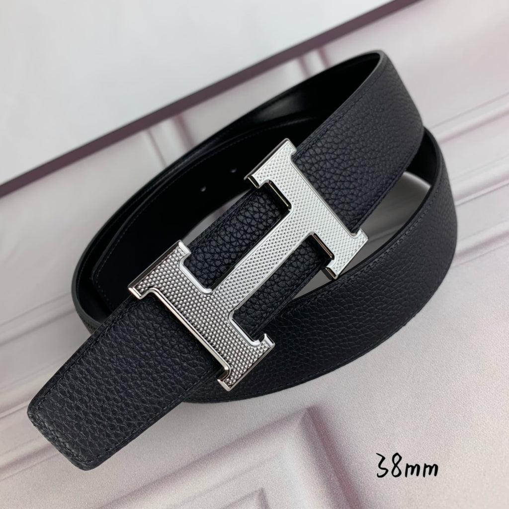 Black pebbled leather belt with silver H-style buckle and folded strap ends