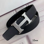 Black pebbled leather belt with silver H-style buckle and folded strap ends