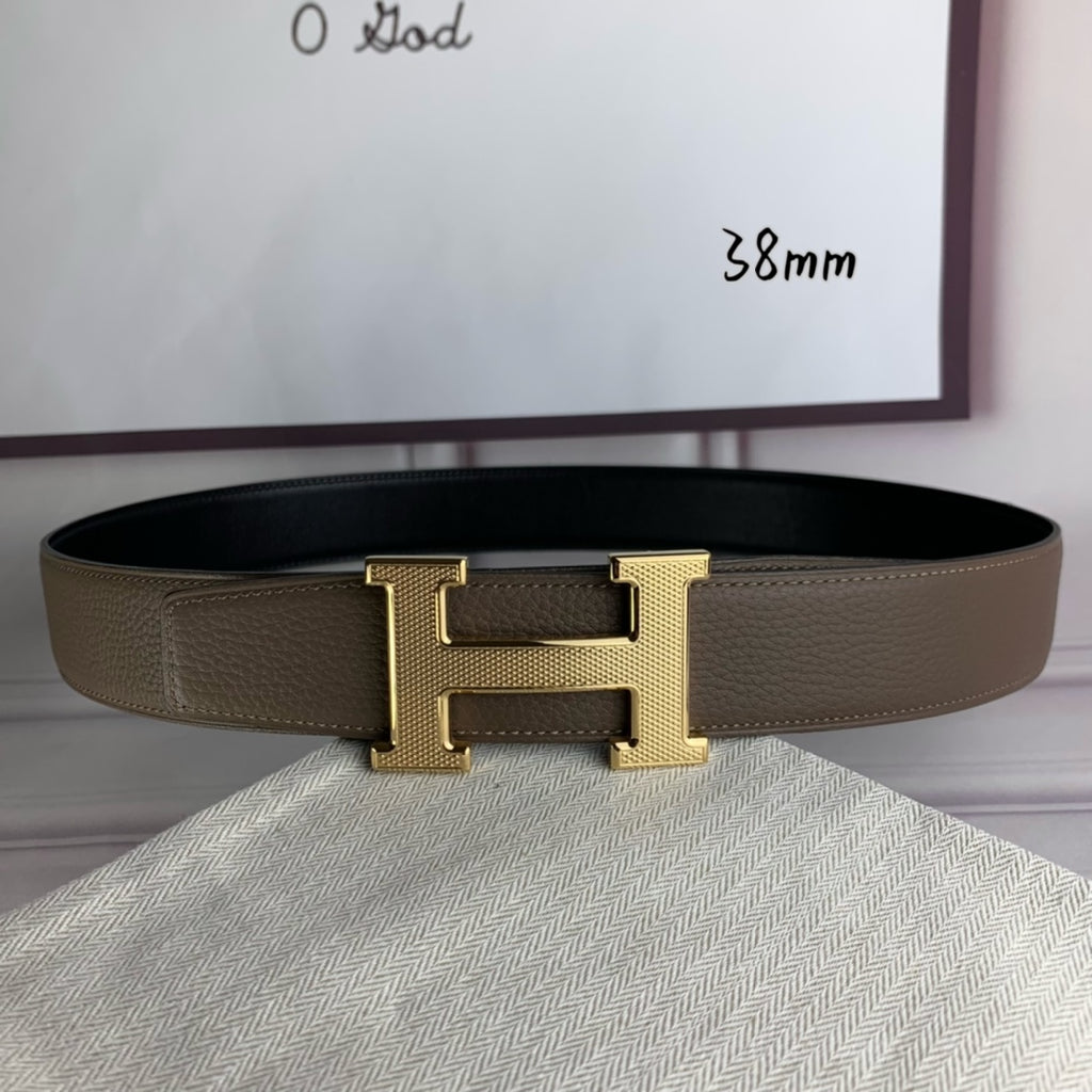 Leather belt with gold H buckle, textured strap, and single-prong keeper
