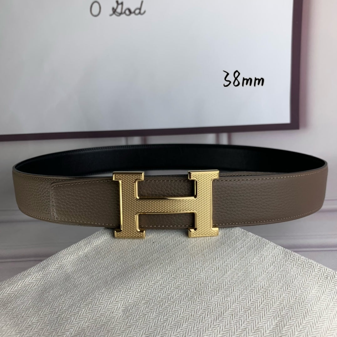 Leather belt with gold H buckle, textured strap, and single-prong keeper