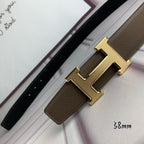 Leather belt with gold H buckle, textured tan strap, and belt keeper