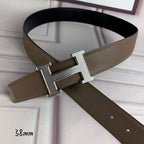Leather belt with silver-toned H buckle and textured tan strap