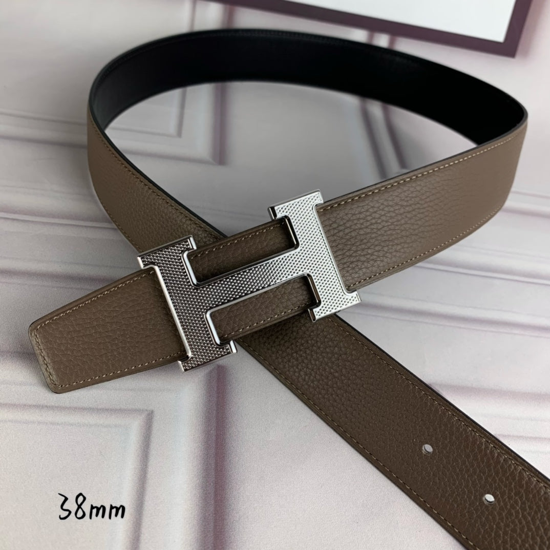 Leather belt with silver-toned H buckle and textured tan strap