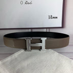 Leather belt with gold H buckle centerpiece and textured finish on the strap
