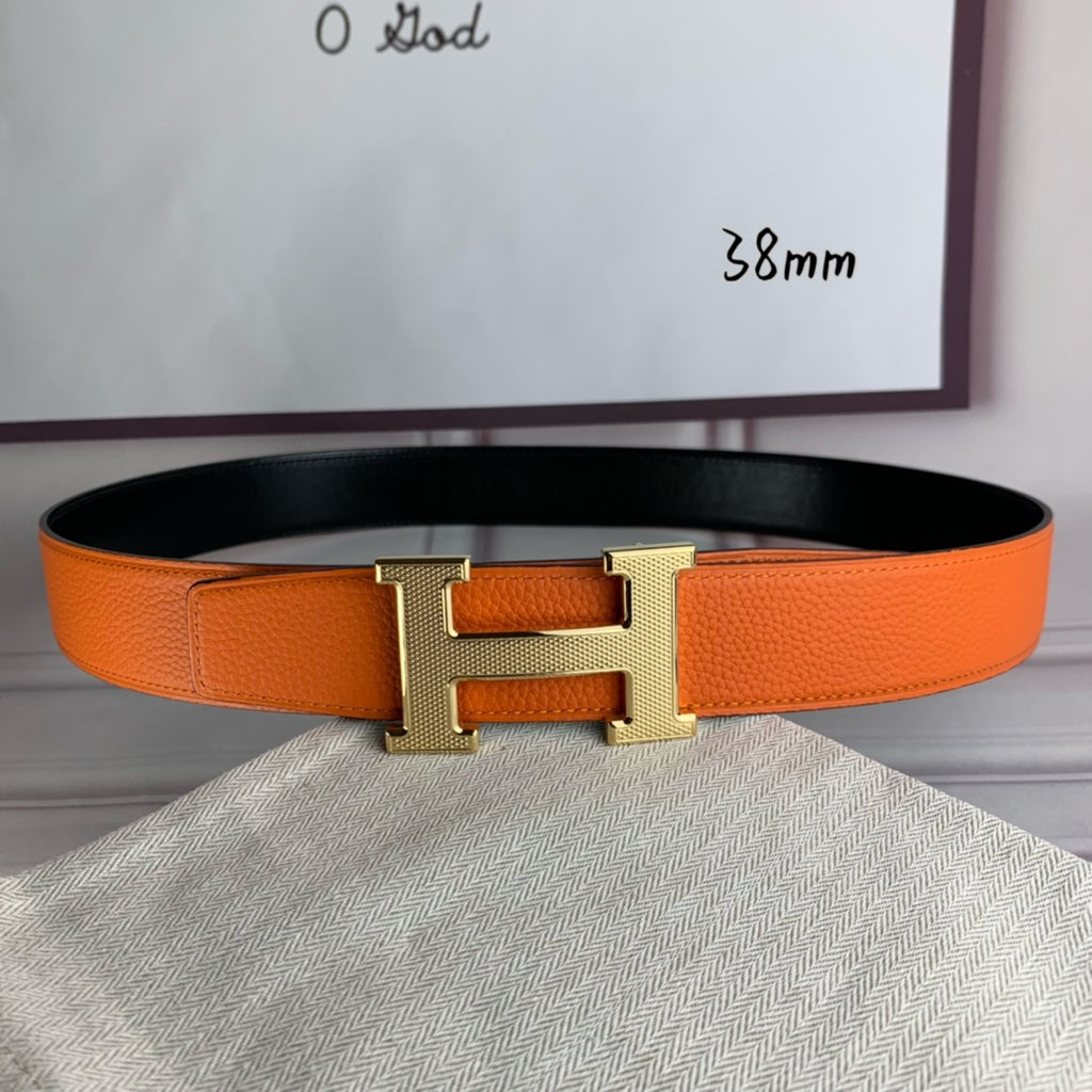 Orange leather belt with silver-tone H buckle and stitched edge