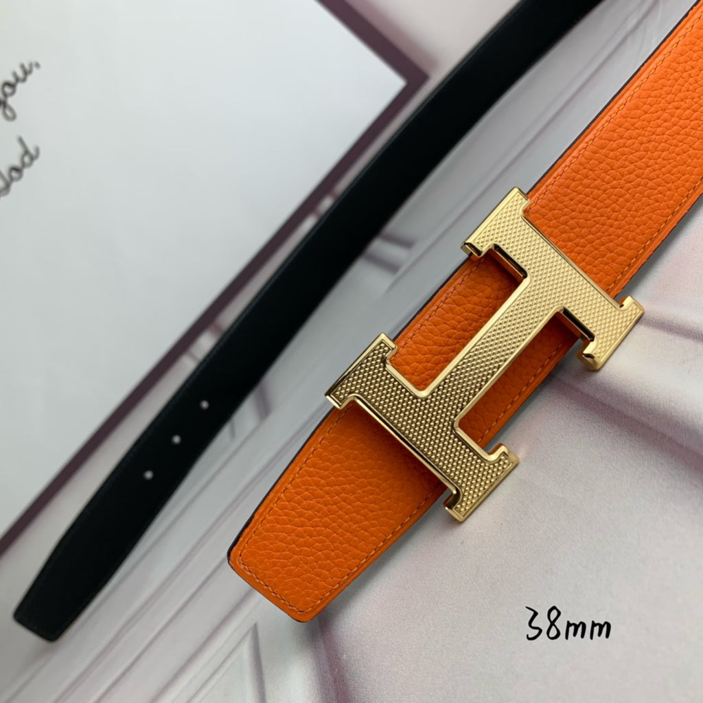 Orange leather belt with gold-tone H buckle, close-up angle