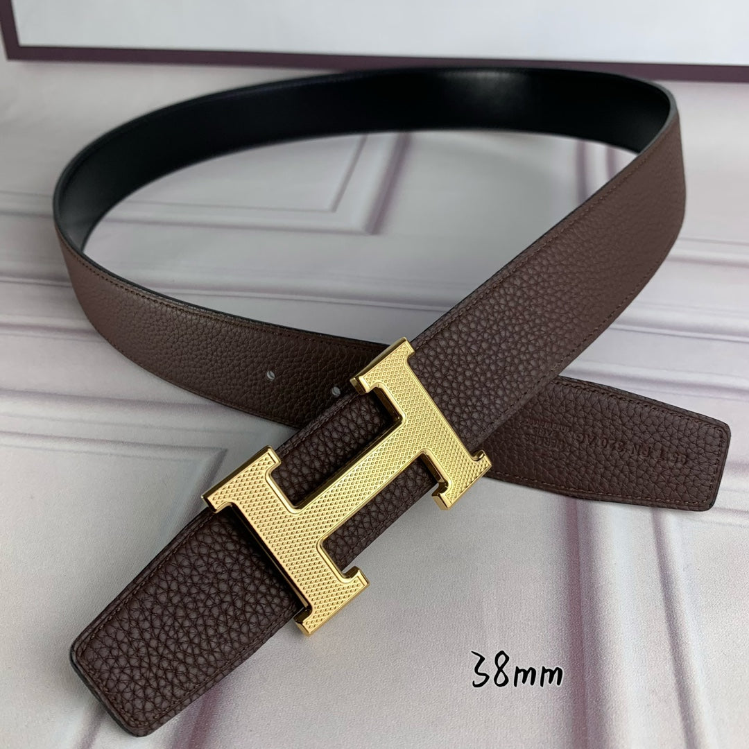 Hermes belt with large gold H buckle on brown leather strap