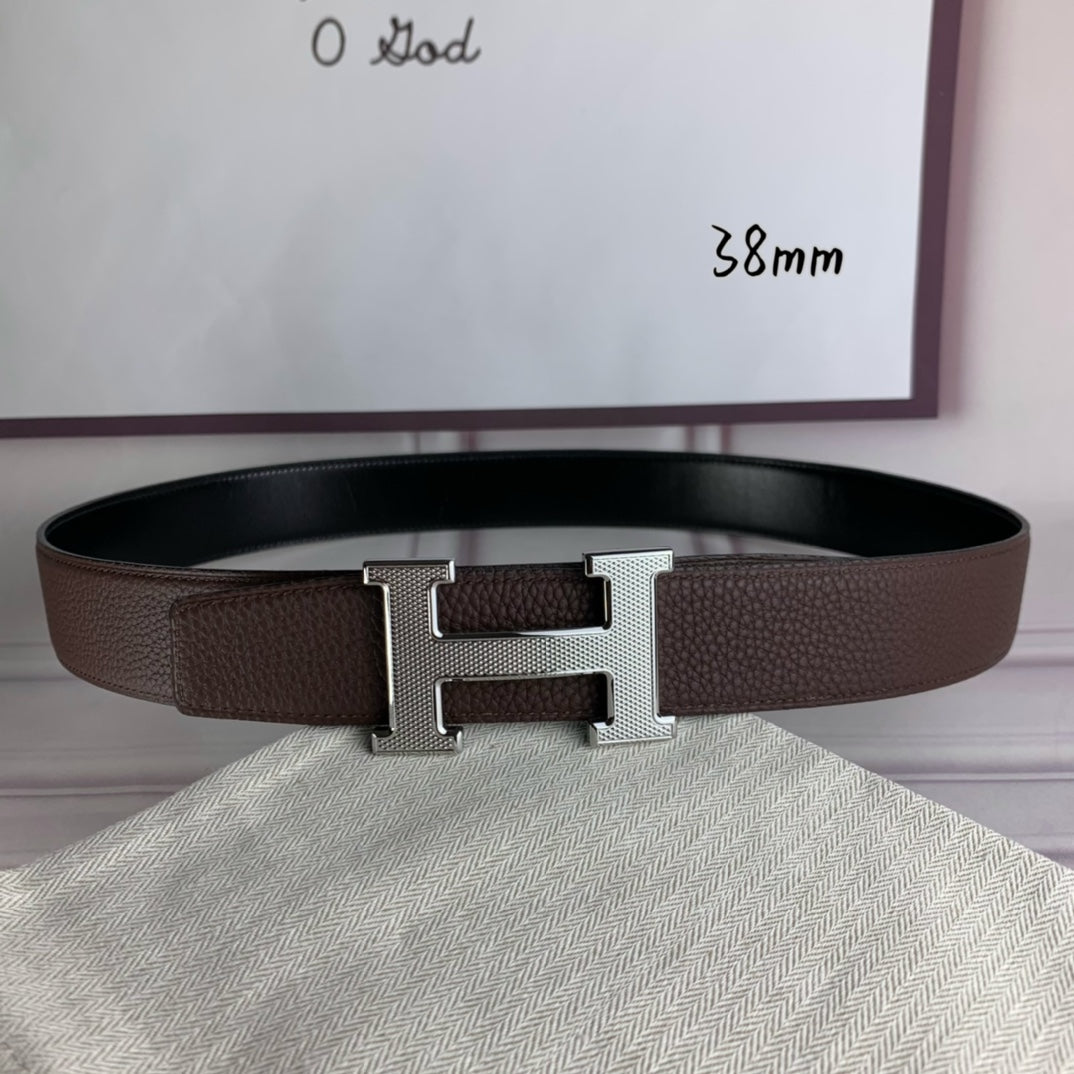 Hermes belt with gold H buckle centered on brown textured strap