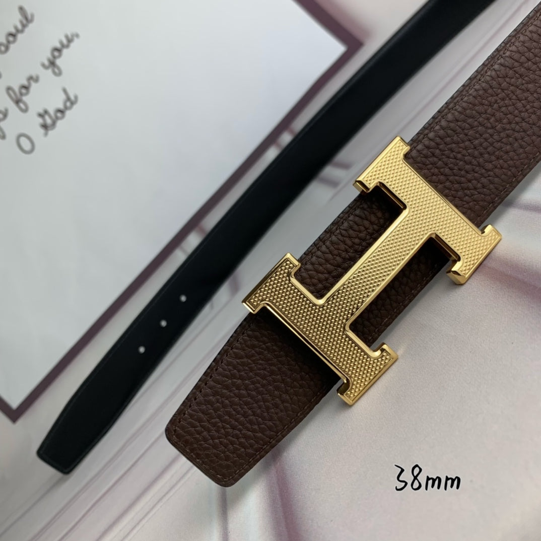 Hermes belt with gold H buckle on brown leather strap, leather keeper
