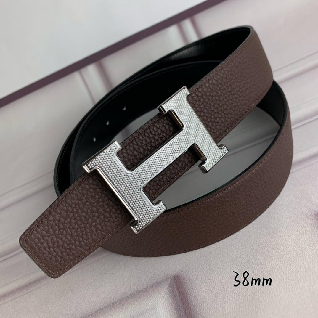Hermes belt with silver H buckle on brown leather strap, black underside