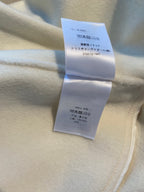 Cream long coat interior care labels