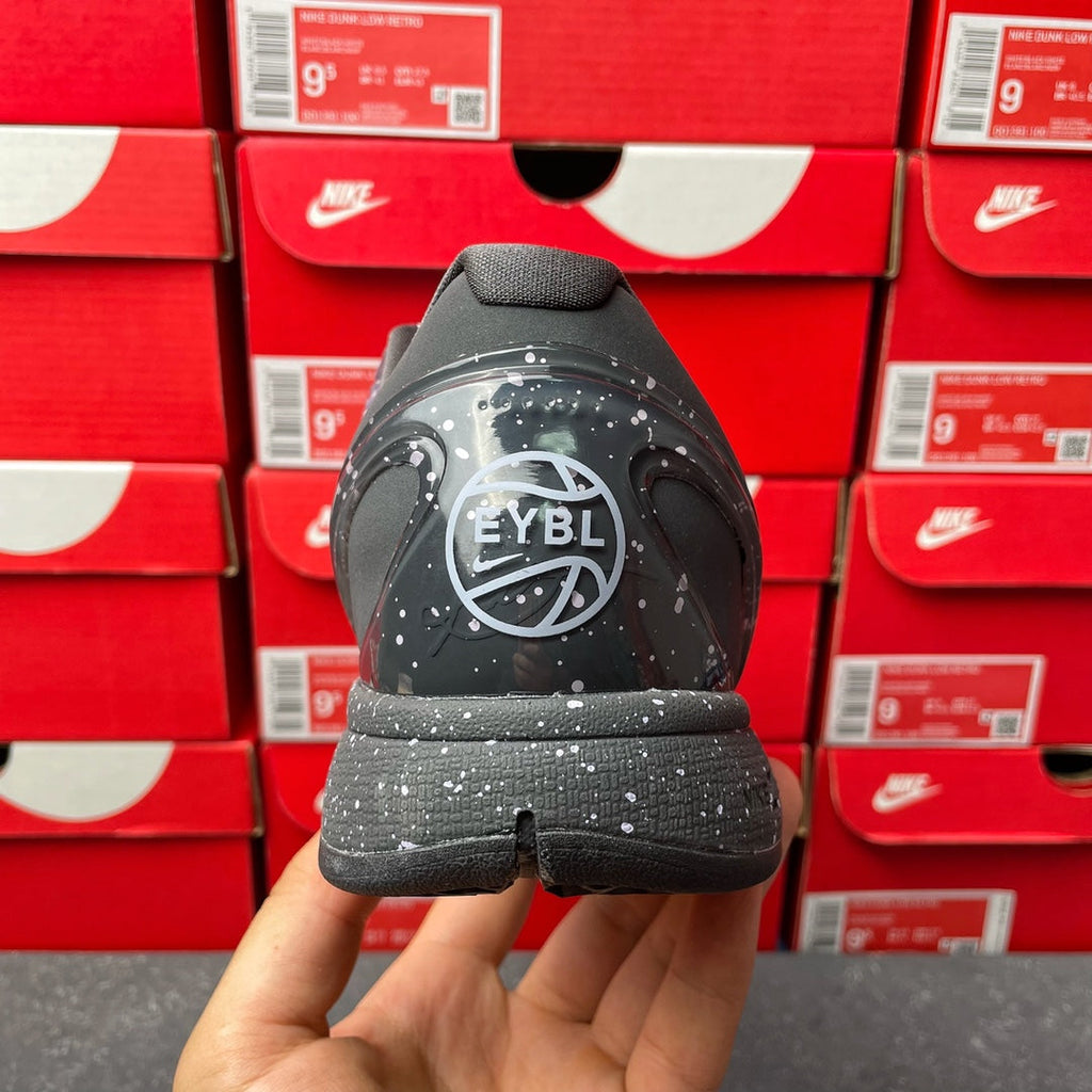 Basketball sneaker heel view with “EYBL” logo on black outsole, lace-up upper.