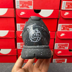 Basketball sneaker heel view with “EYBL” logo on black outsole, lace-up upper.