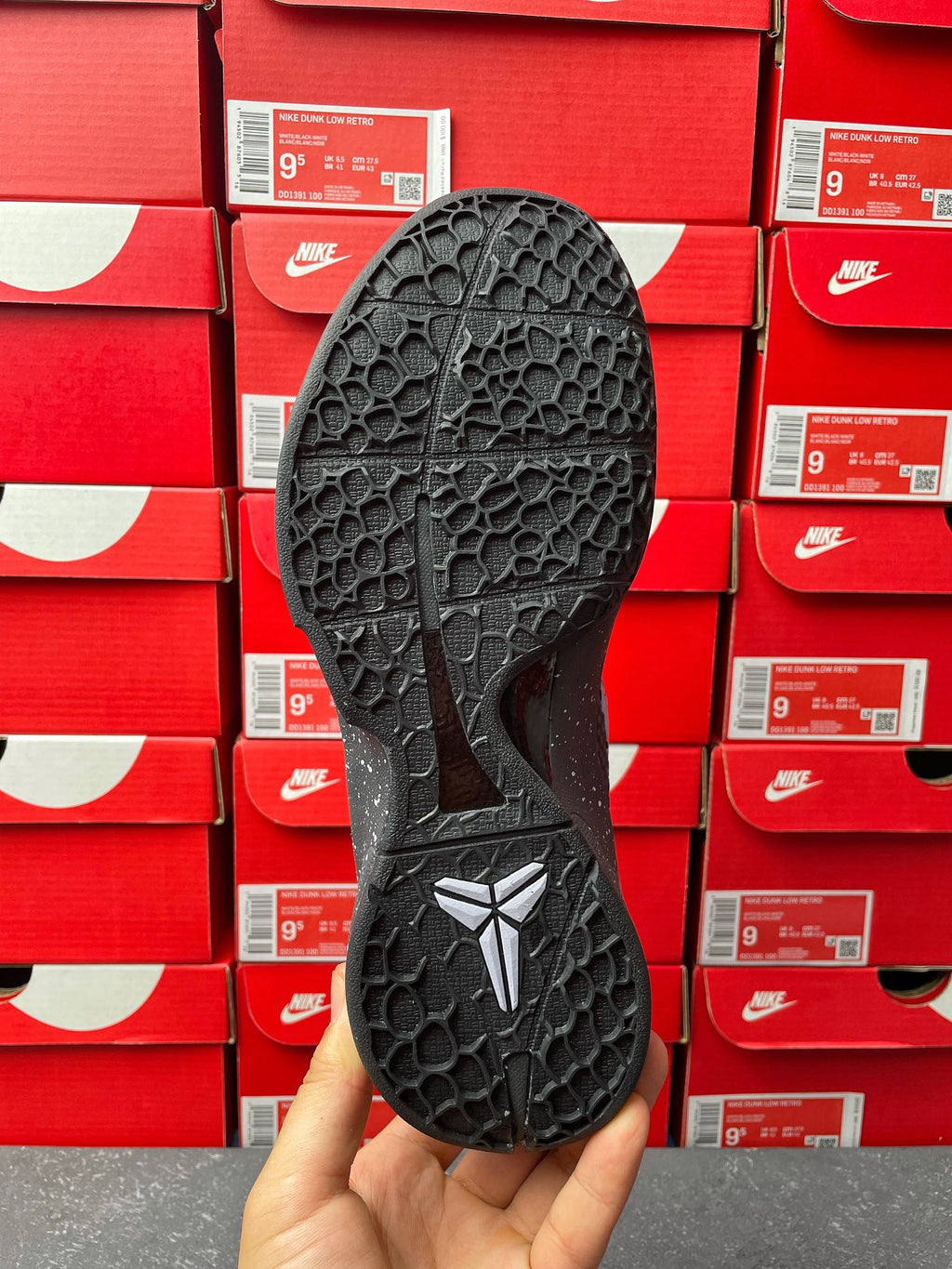 Basketball sneaker outsole with star logo and hex traction, black rubber sole.