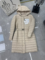 Long beige quilted puffer coat with hood and front buttons plus belt strap