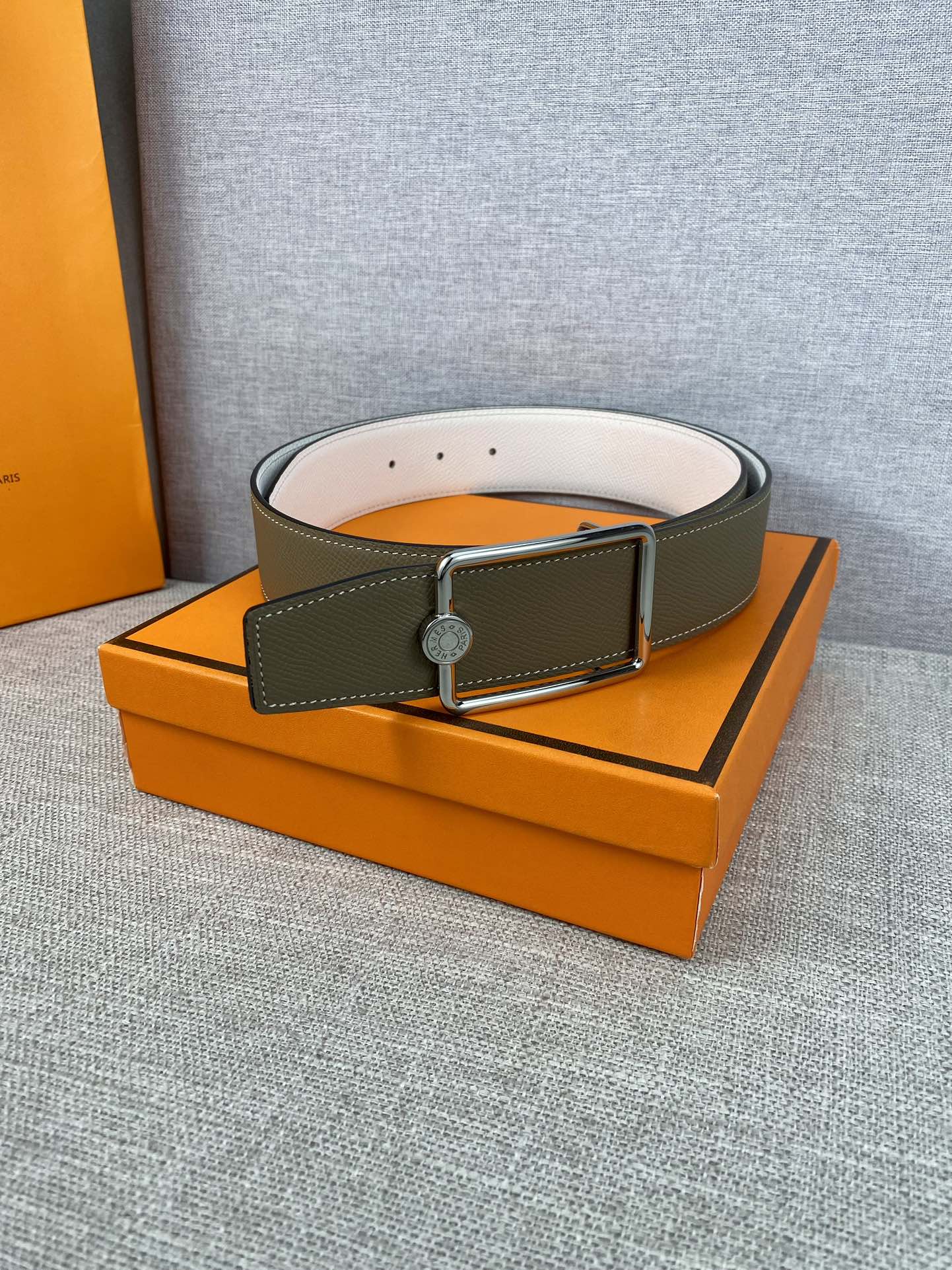 Hermes leather belt on a box: olive strap with silver buckle