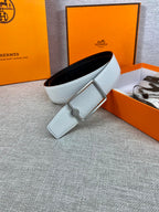 Light blue leather belt with silver rectangular buckle and short keeper tab.