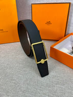 Hermes belt in dark grained leather with gold-tone rectangular buckle