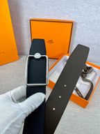 Hermes belt with dark leather strap and silver rectangular buckle