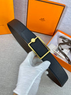 Hermes belt in dark grained leather with gold rectangular buckle