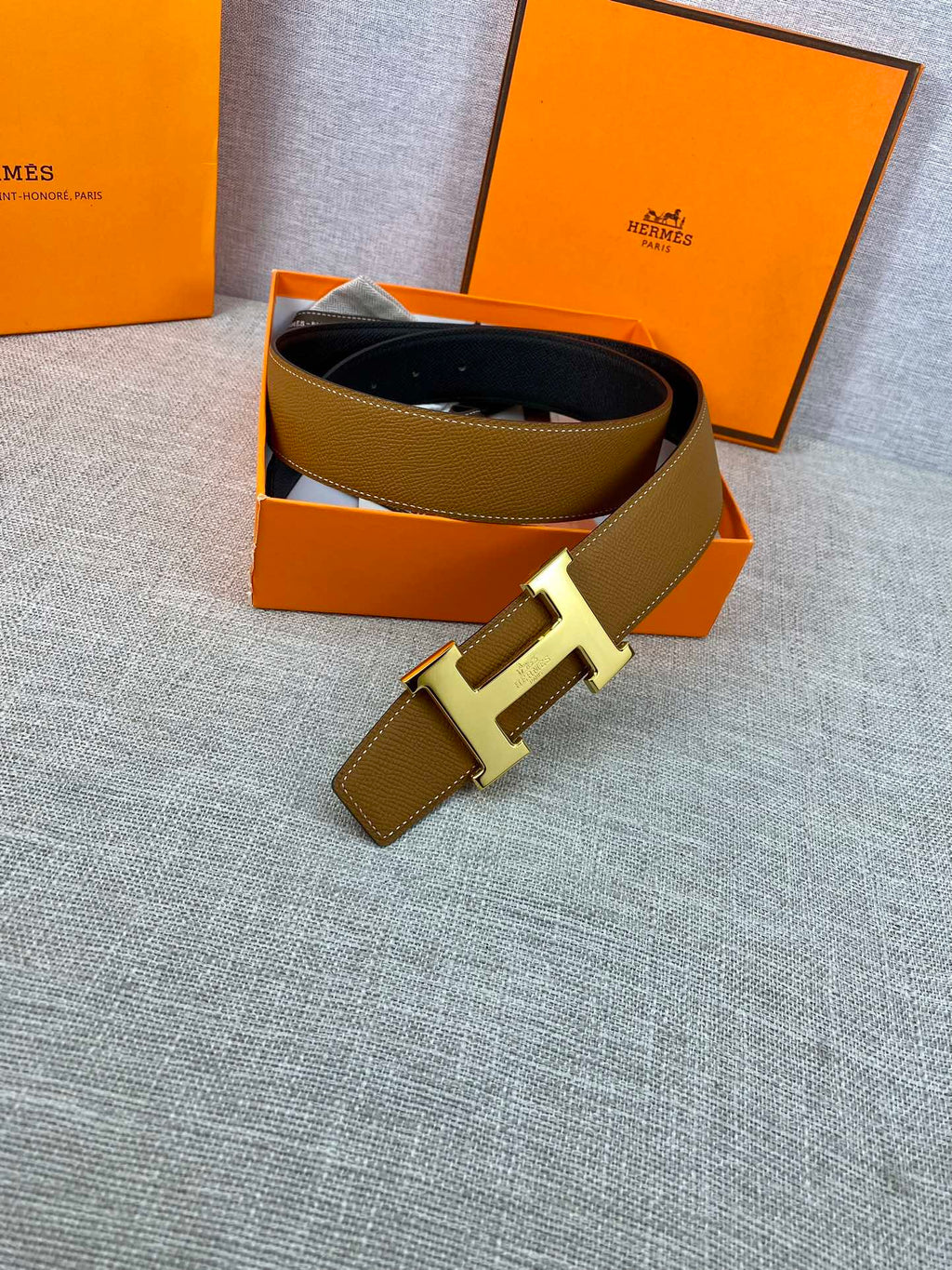 Hermes belt in gift box, tan strap with gold buckle and dark lining