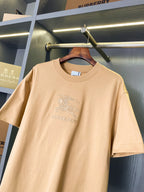 Tan Burberry T-shirt, crew neck, horse rider emblem and small 'BURBERRY' text