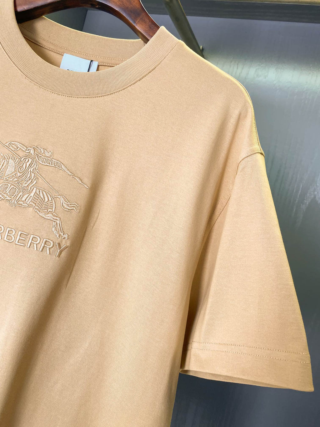 Tan Burberry T-shirt with chest horse rider emblem