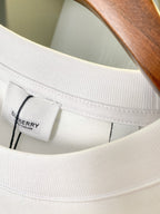 White T-shirt neck label inside with stitched collar opening and seam details