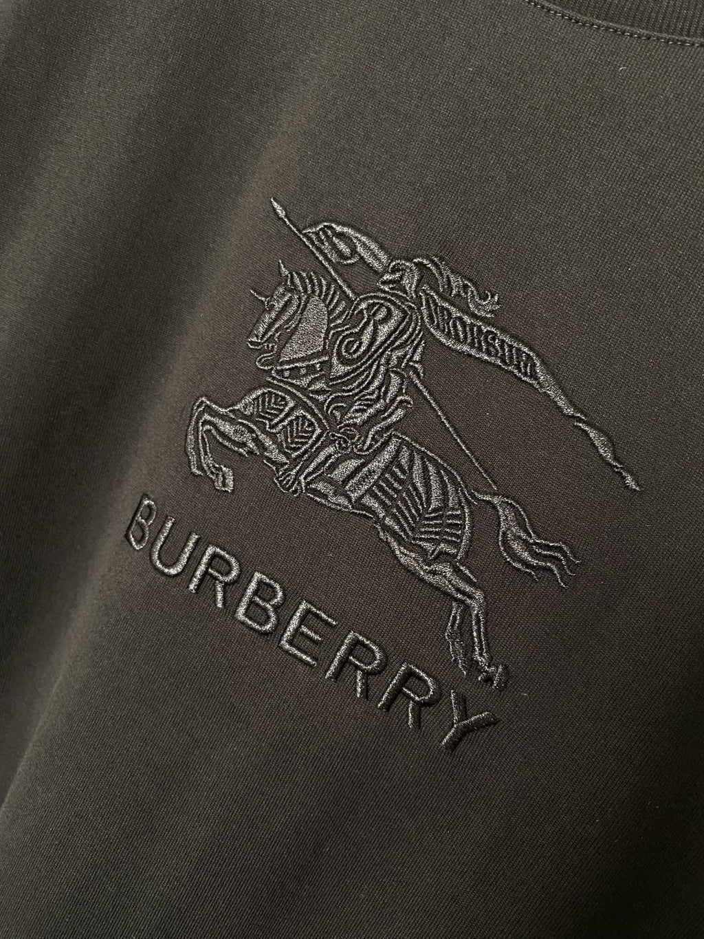 Black T-shirt with horse rider logo and BURBERRY text graphic