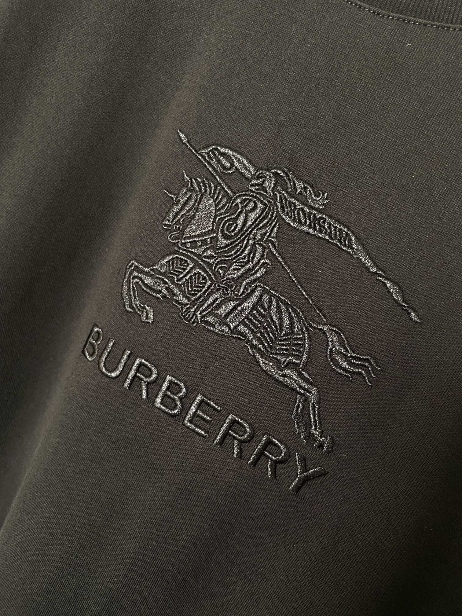 Black T-shirt with horse rider logo and BURBERRY text graphic