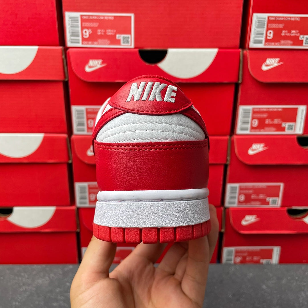 Nike Dunk Low low-top sneaker heel view with white back tab and red outsole tread