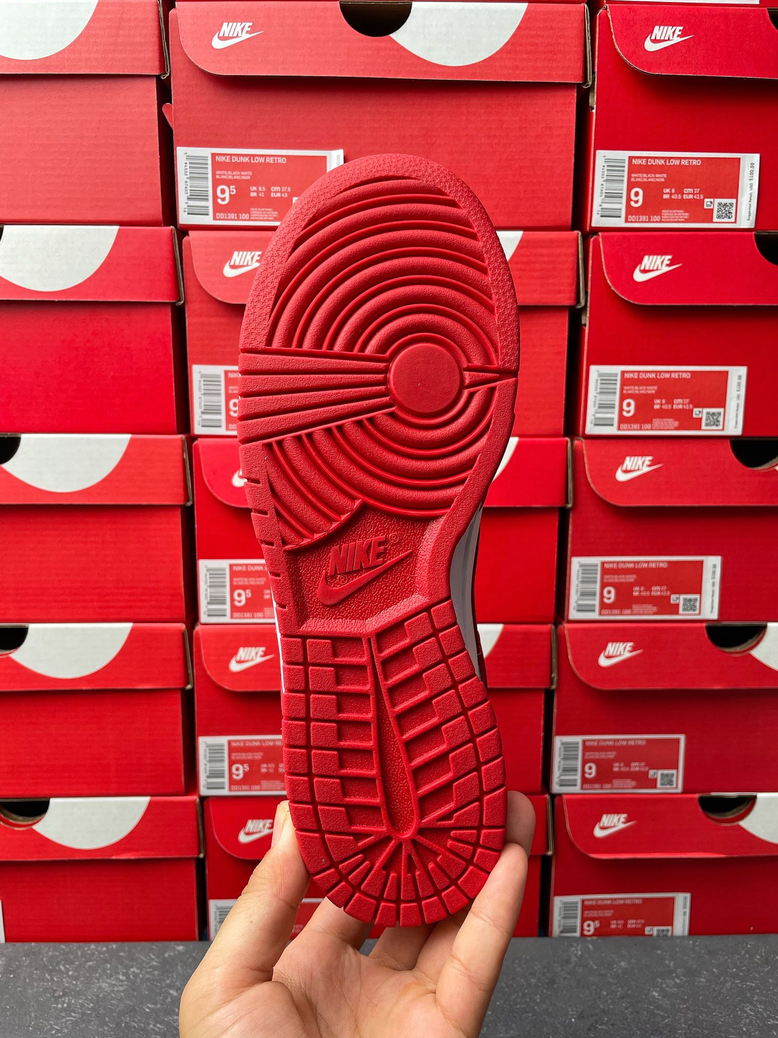 Nike Dunk Low low-top sneaker outsole view with textured red traction pattern