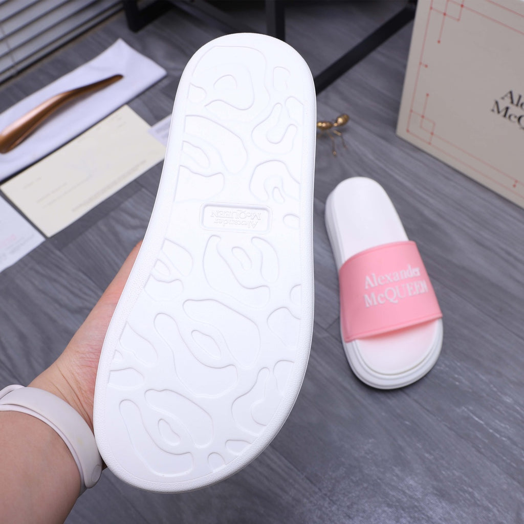 Alexander McQueen slide sandals, outsole view with white tread and pink strap