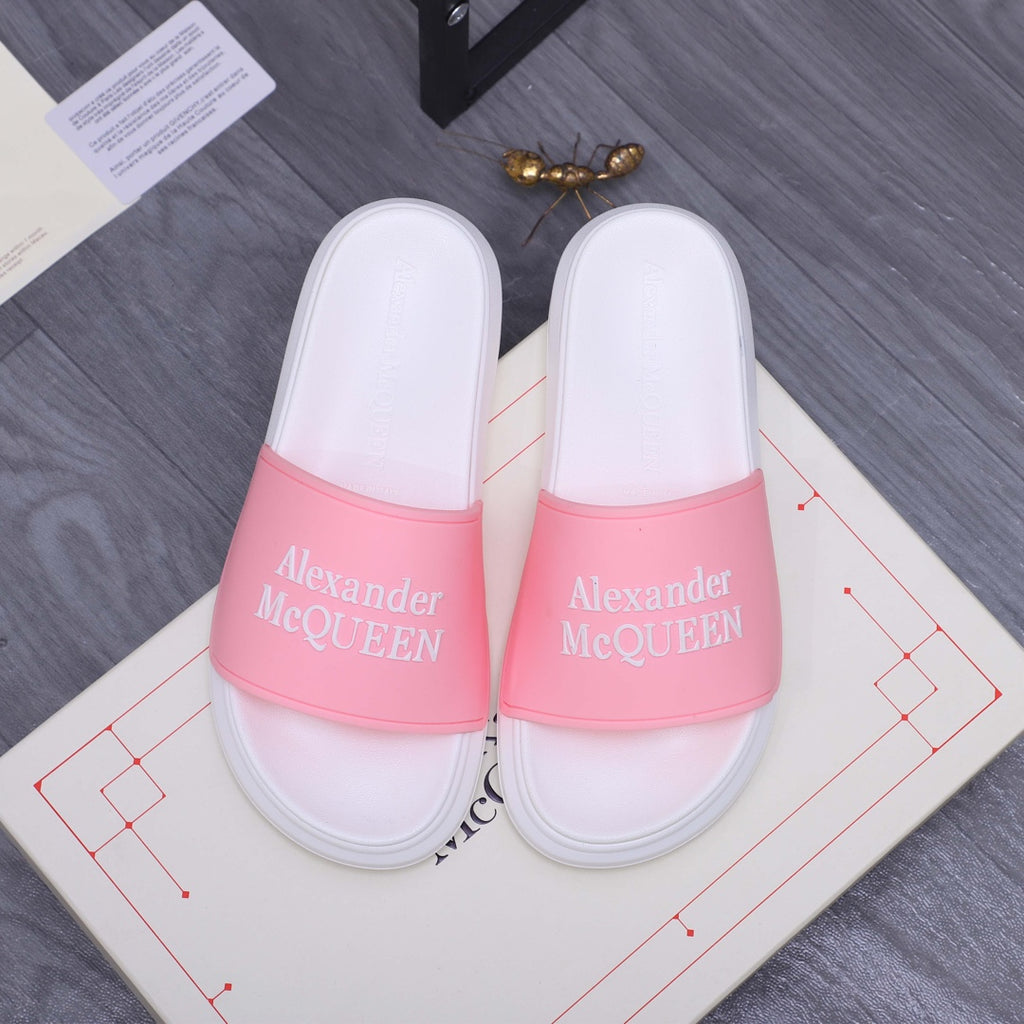 Alexander McQueen slide sandals with white footbed and pink logo strap band