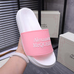 Alexander McQueen slide sandal on pink strap band over white footbed
