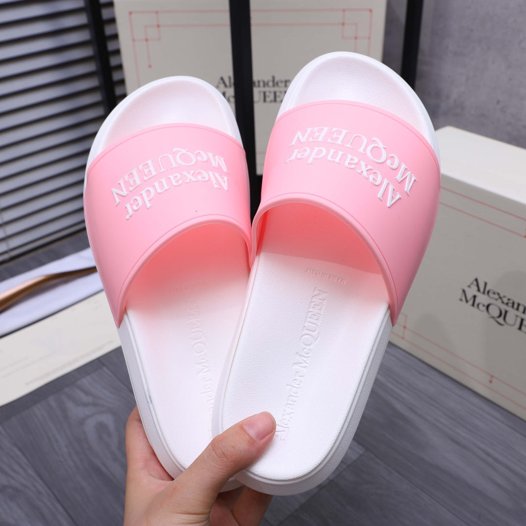 Alexander McQueen slide sandals, underside view with white footbed and pink strap