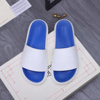 Alexander McQueen slides, white straps with blue footbeds and embossed logo