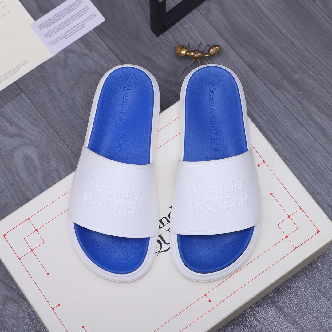 Alexander McQueen slides, white straps with blue footbeds and embossed logo