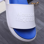 Alexander McQueen slide strap with embossed Alexander McQueen lettering on white