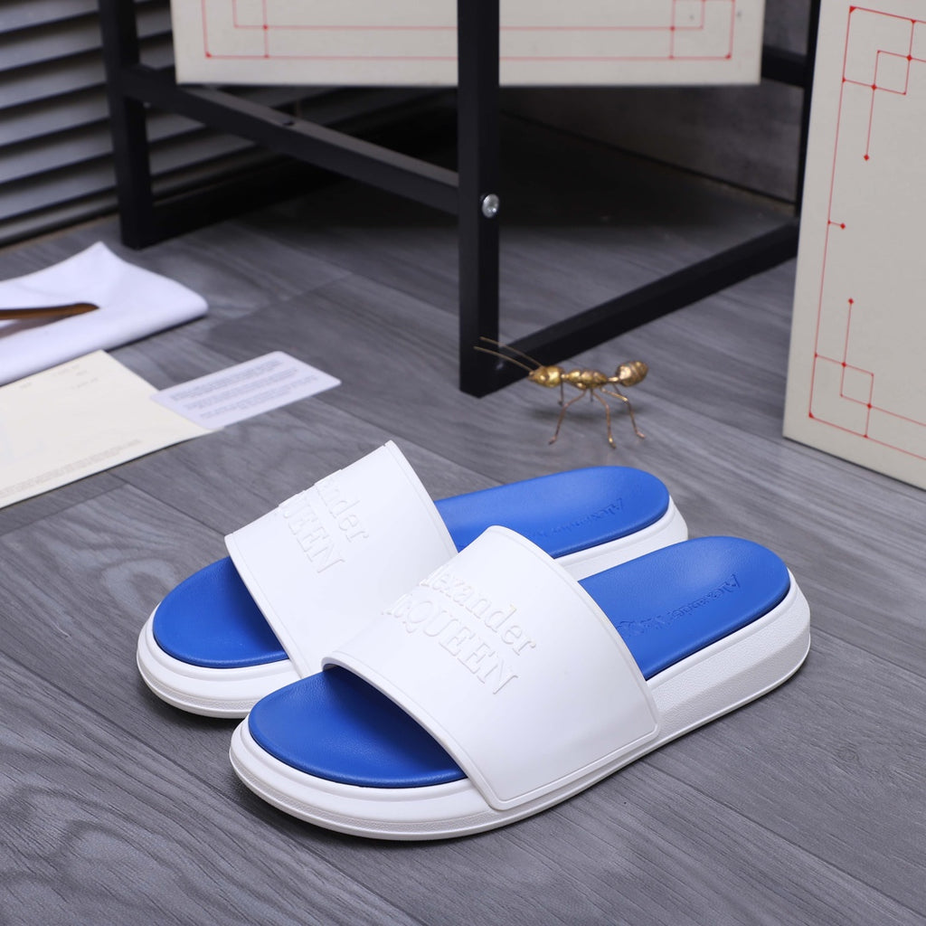 Alexander McQueen slides with white strap over blue footbed, flat slide sole