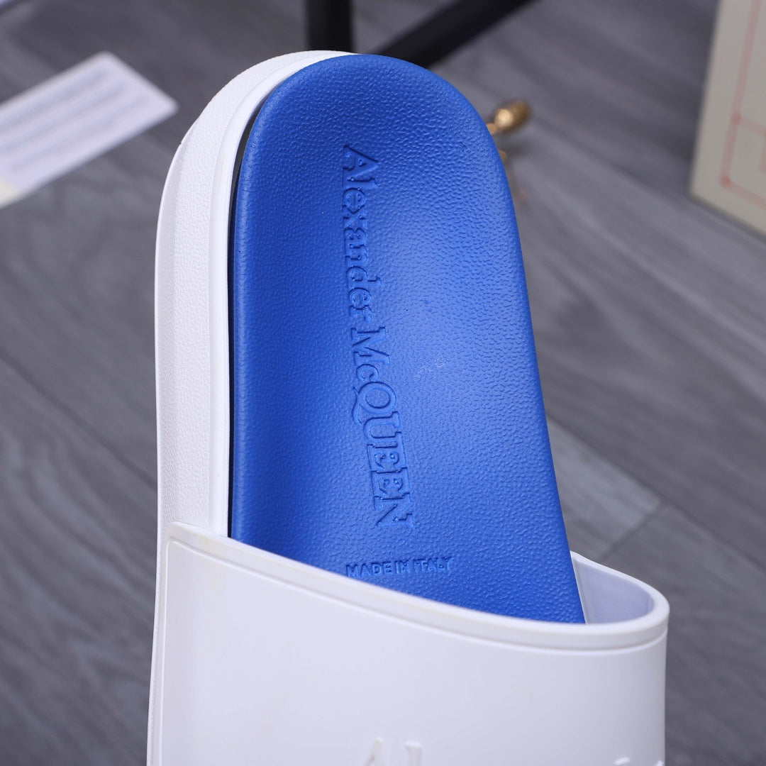 Alexander McQueen slide footbed in blue with embossed logo text