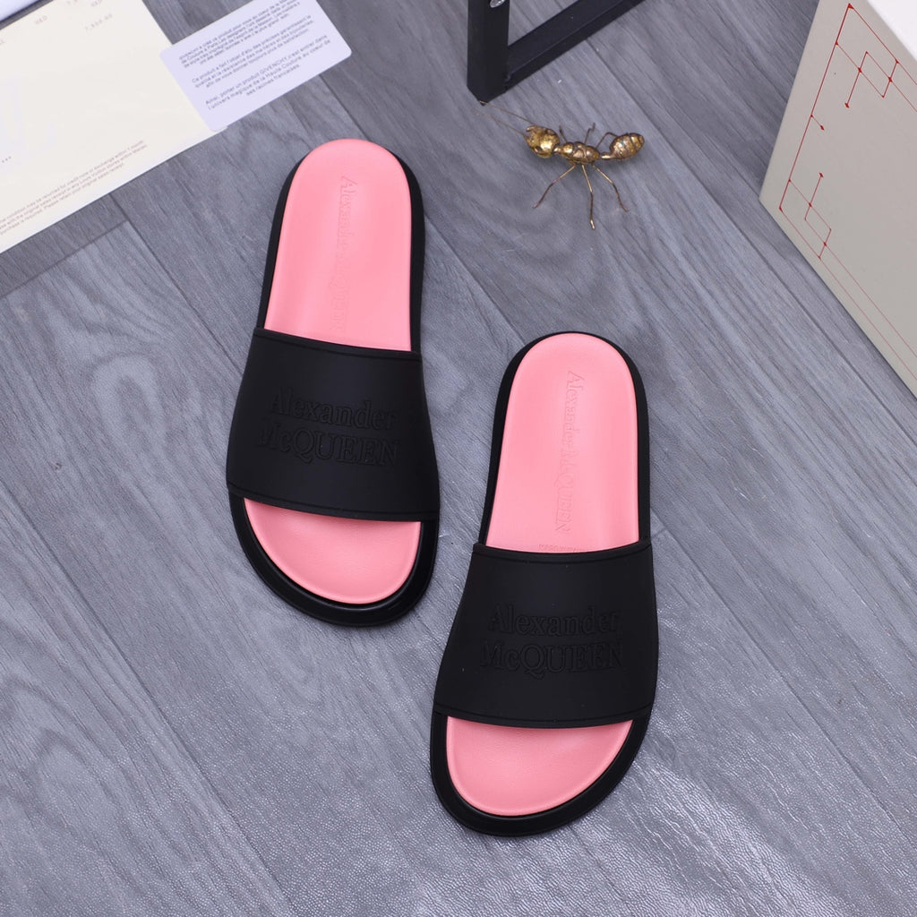 Slide sandals set: two black-and-pink sandals with embossed logo on the black strap bands