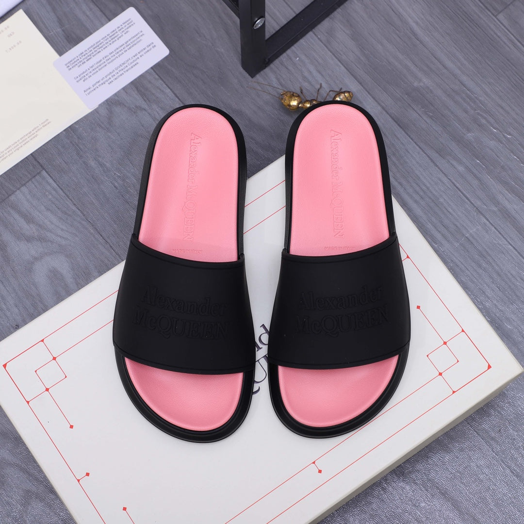 Slide sandals with black straps and pink footbeds, Alexander McQUEEN embossed on the band