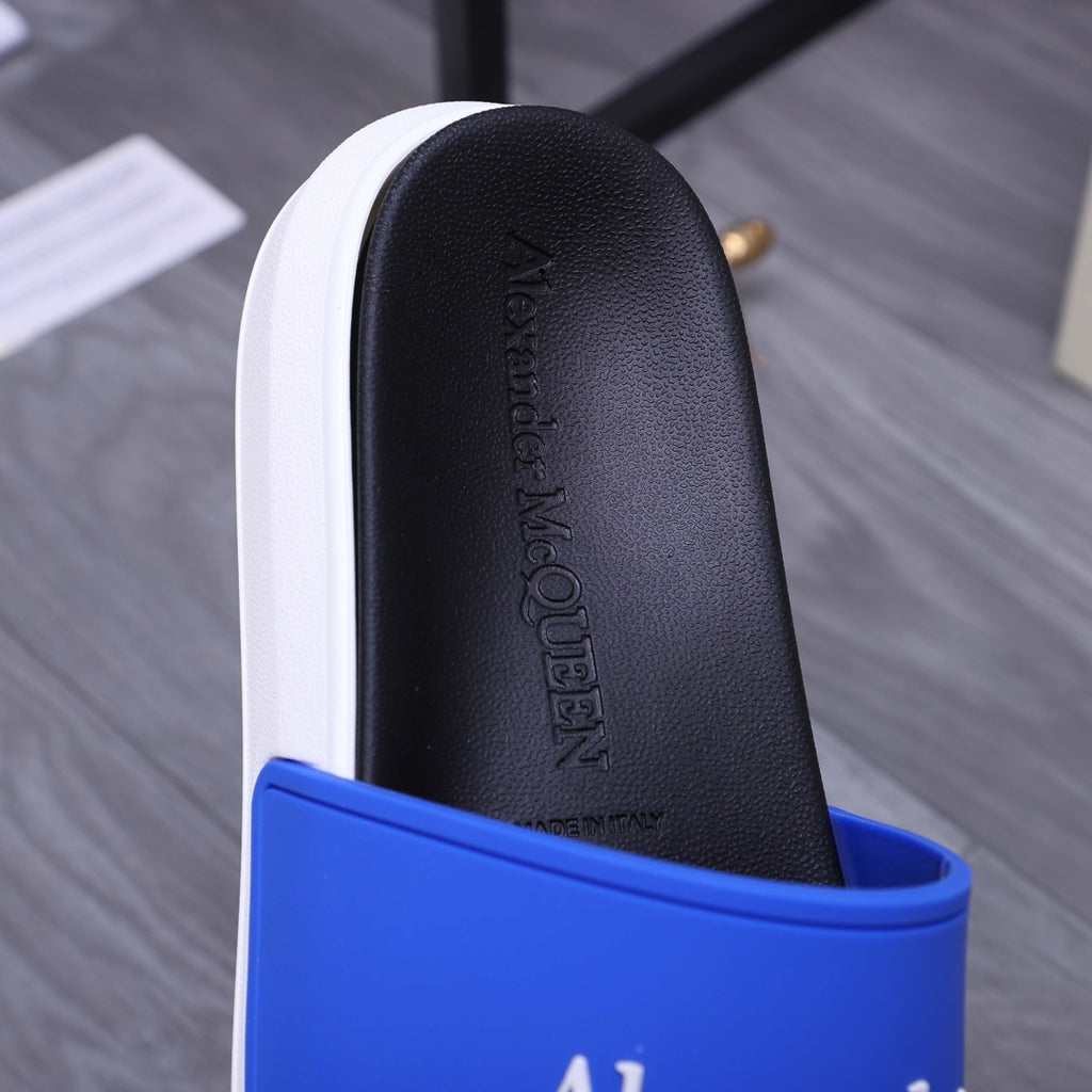 Black insole of Alexander McQueen slide sandal with embossed logo, blue strap