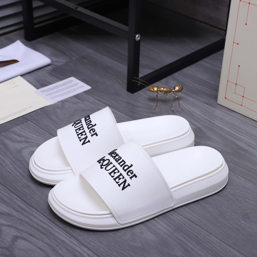 Alexander McQueen white leather slide sandals with printed logo strap, pair