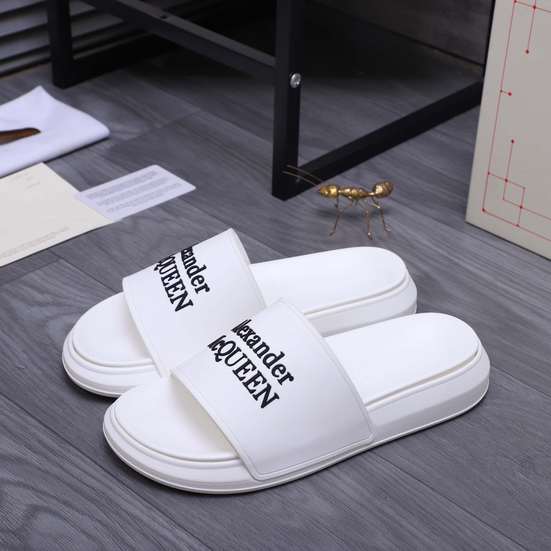 Alexander McQueen white leather slide sandals with printed logo strap, pair